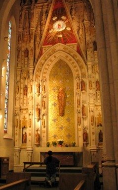 man praying in church